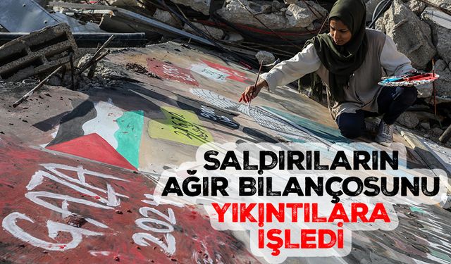 Gazze'de kadın sanatçı, "katil İsrail saldırılarının ağır bilançosunu" yıkıntıların üzerine yaptığı resme işledi