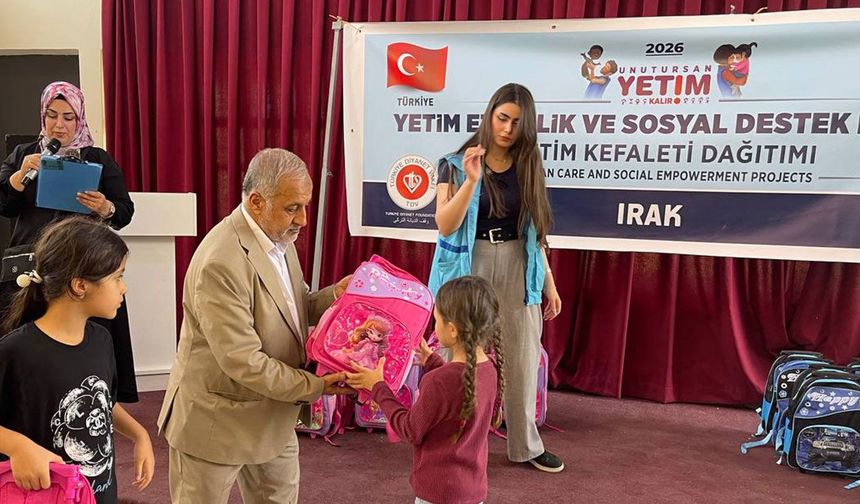 TDV, Kerkük'te ihtiyaç sahibi yetimlere kıyafet ve kırtasiye desteği sağladı